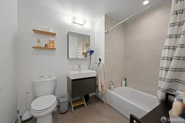 a bathroom with a toilet a sink and a bathtub