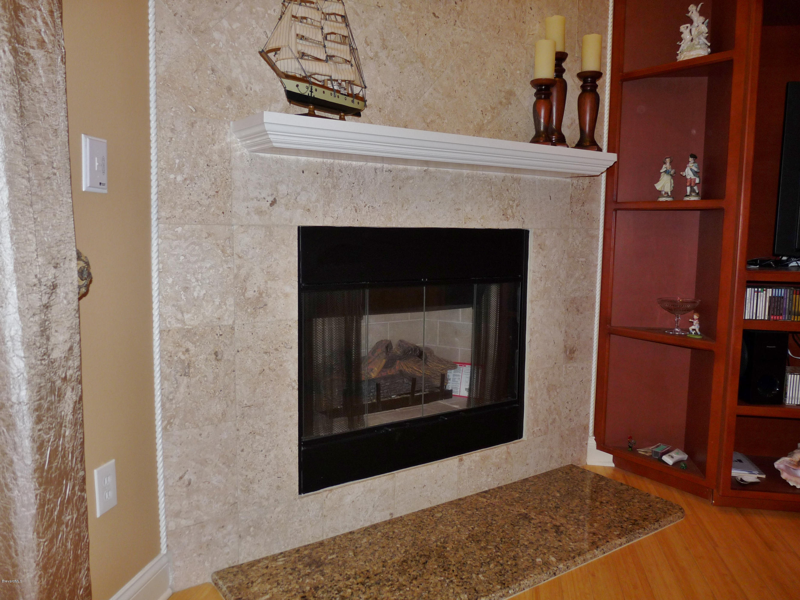 890 Maple Ridge Drive Merritt Island, FL 32952 - Photo 13 of 25 Family Room Fireplace