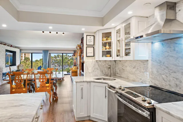 a kitchen that has a lot of cabinets in it