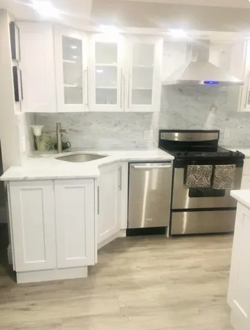 a kitchen with a stove and a sink