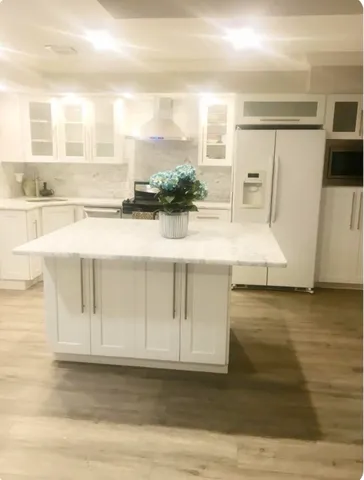 a view of kitchen with wooden floor