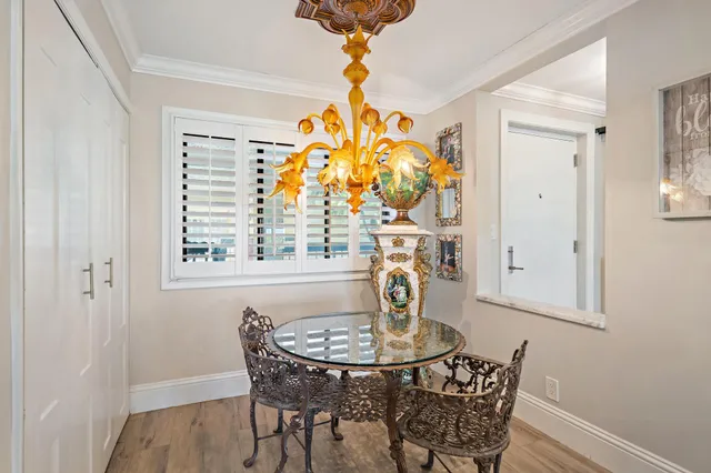 a view of a dining room with furniture and window