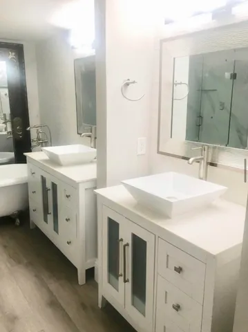 a bathroom with a sink and a mirror