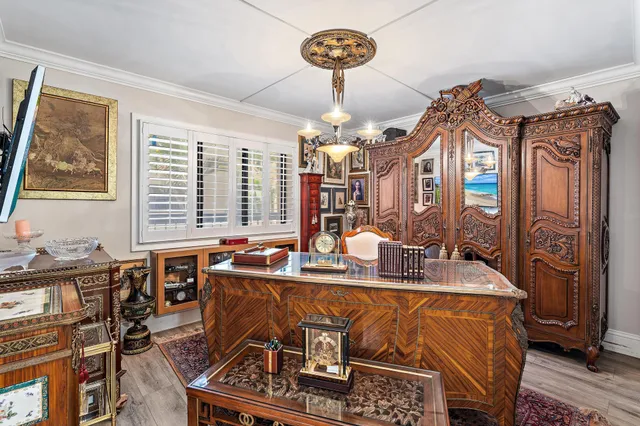 a view of a dining room with furniture wooden floor and chandelier