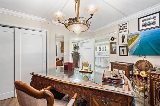 a table room with furniture and chandelier