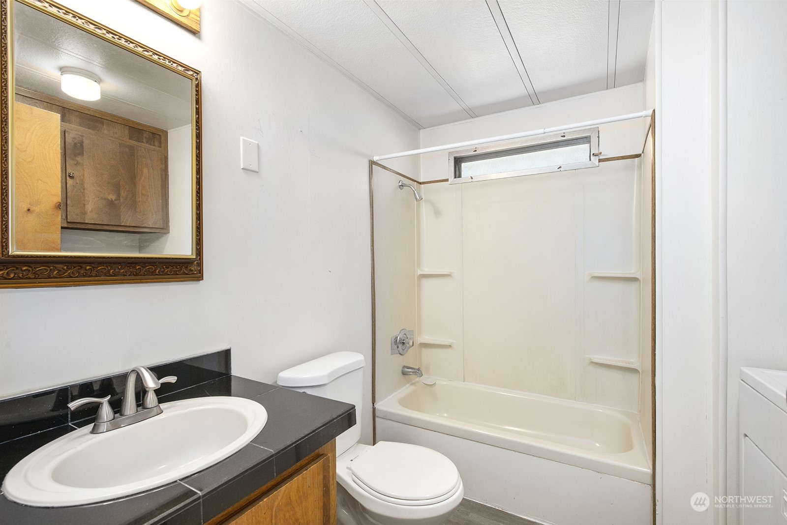2302 R Street Southeast, Unit 140 Auburn, WA 98002 - Photo 15 of 18 a bathroom with a sink toilet and shower