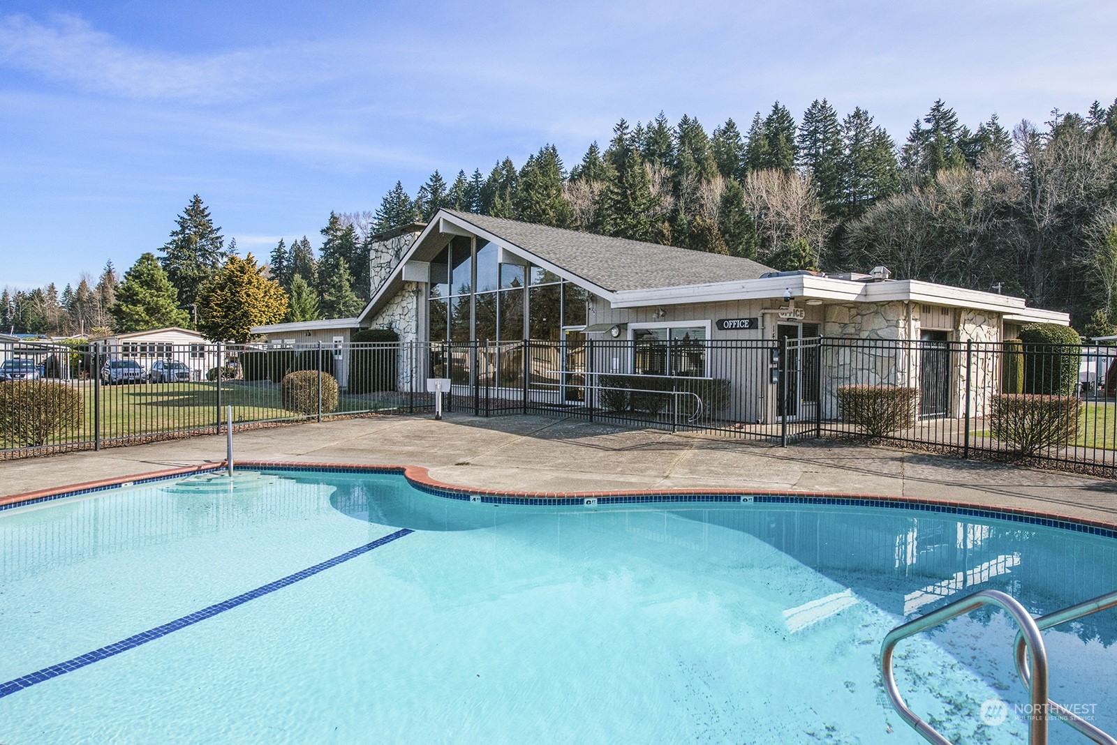 2302 R Street Southeast, Unit 140 Auburn, WA 98002 - Photo 17 of 18 a view of a house with swimming pool and sitting area