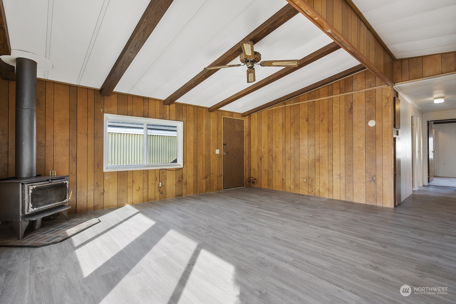 2302 R Street Southeast, Unit 140 Auburn, WA 98002 - Photo 5 of 18 a view of a room with wooden floor and windows