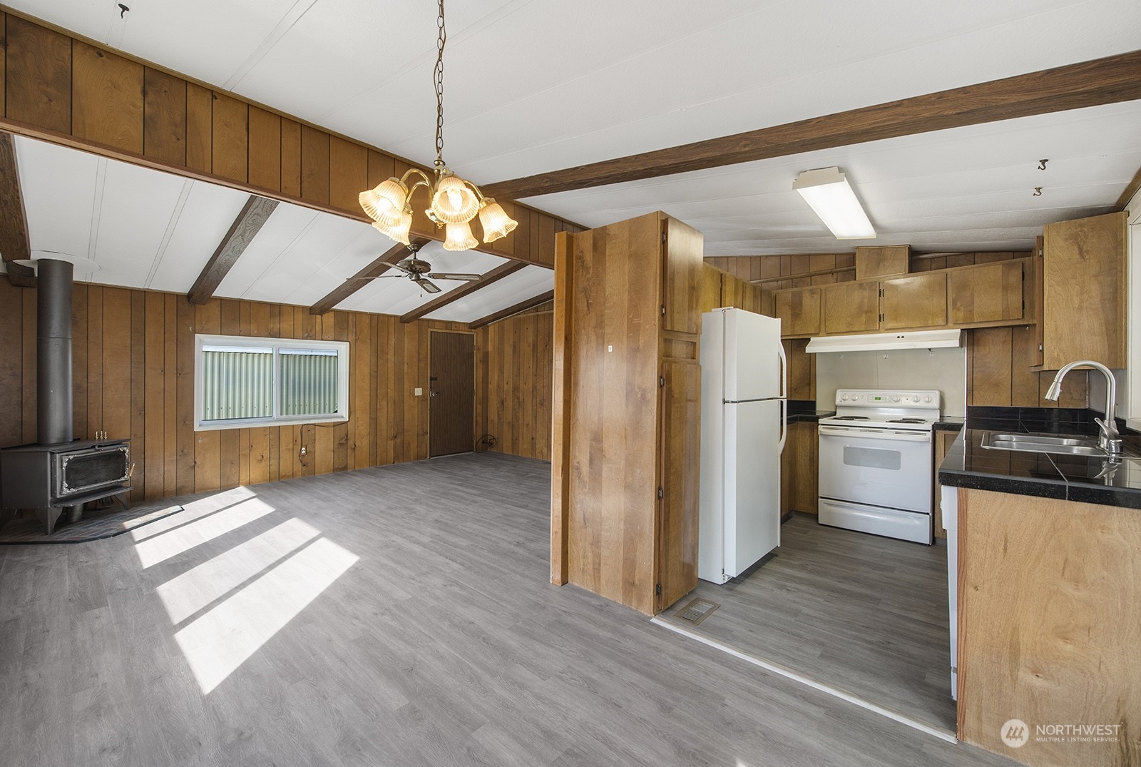 2302 R Street Southeast, Unit 140 Auburn, WA 98002 - Photo 8 of 18 a view of a kitchen with a refrigerator a stove top oven a sink and dishwasher