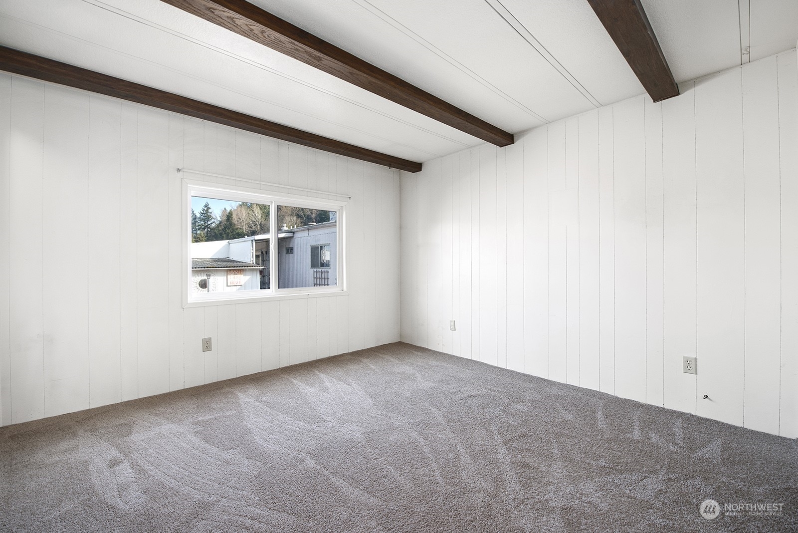 2302 R Street Southeast, Unit 140 Auburn, WA 98002 - Photo 10 of 18 a view of an empty room with a window