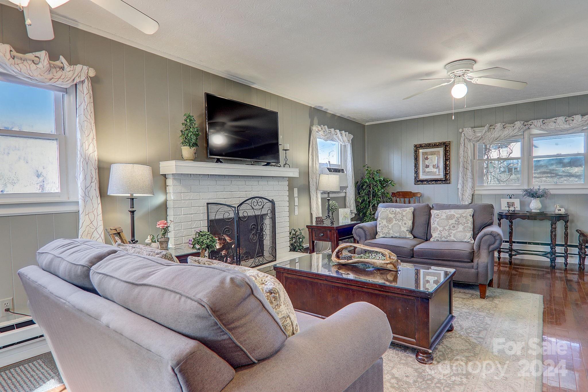 36 Brookside Lane Maggie Valley, NC 28751 - Photo 10 of 48 a living room with furniture fireplace and flat screen tv