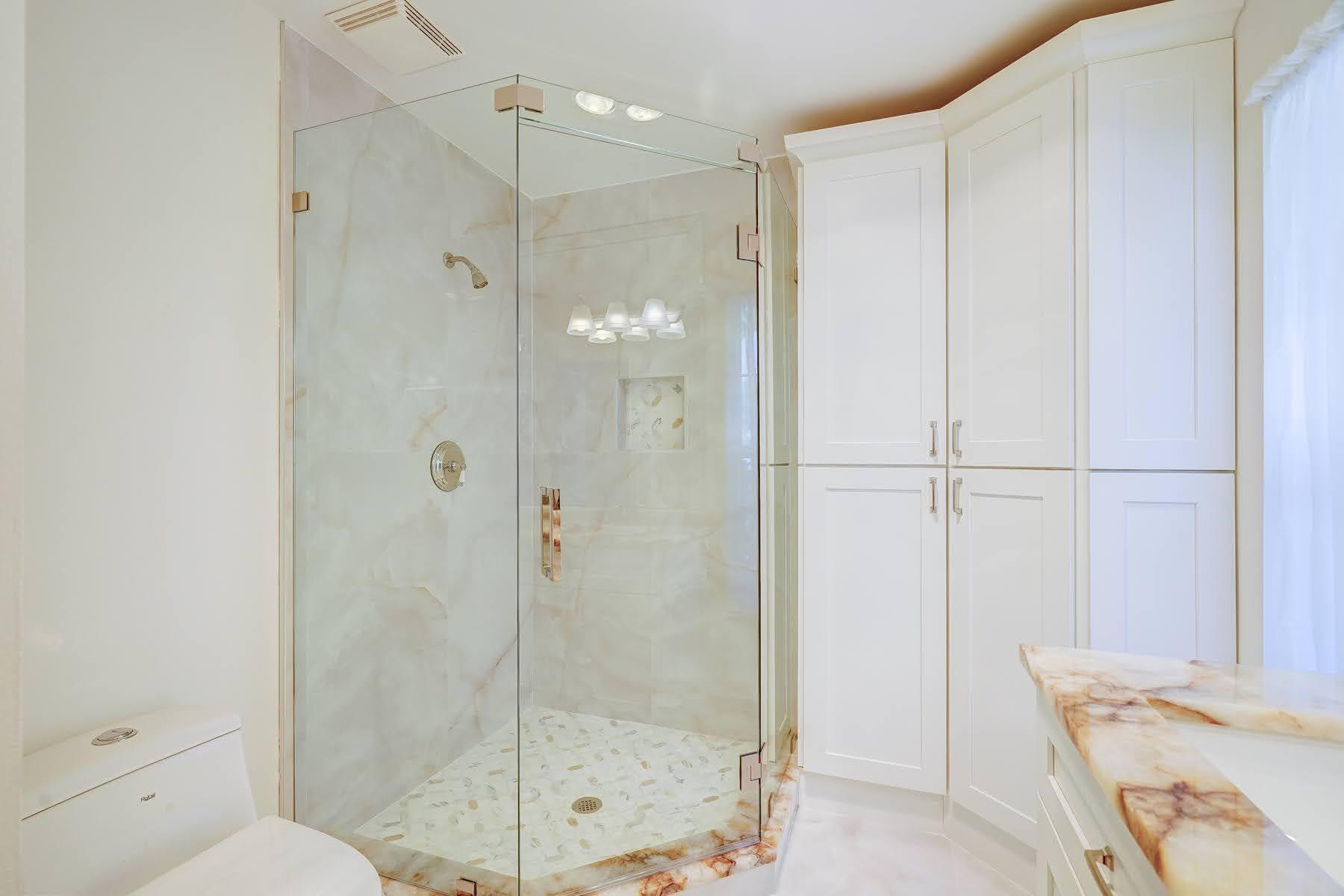 752 Southwest 36th Avenue Delray Beach, FL 33445 - Photo 22 of 40 a bathroom with a shower and a toilet