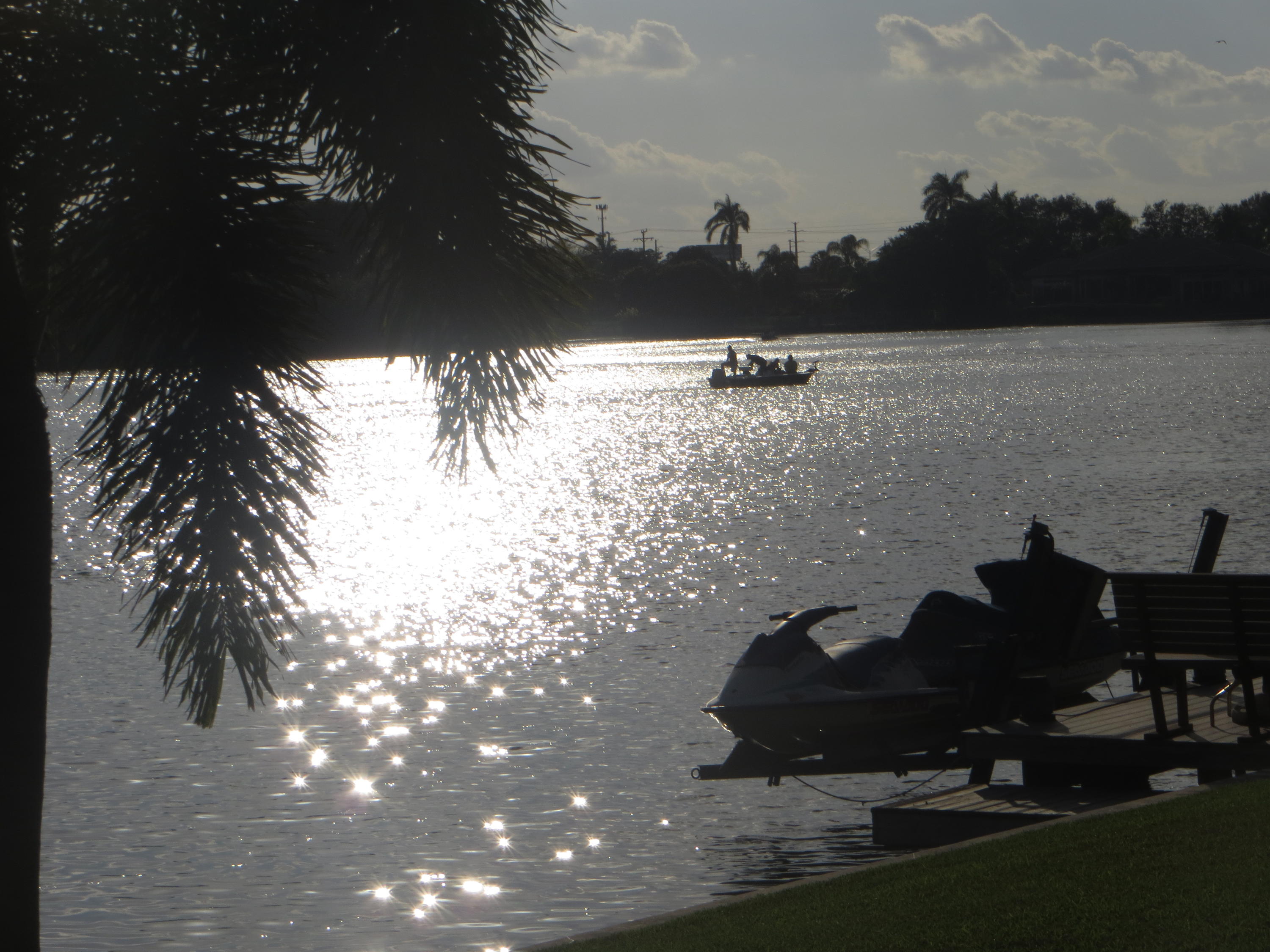 752 Southwest 36th Avenue Delray Beach, FL 33445 - Photo 4 of 40 a view of a lake in between two of trees
