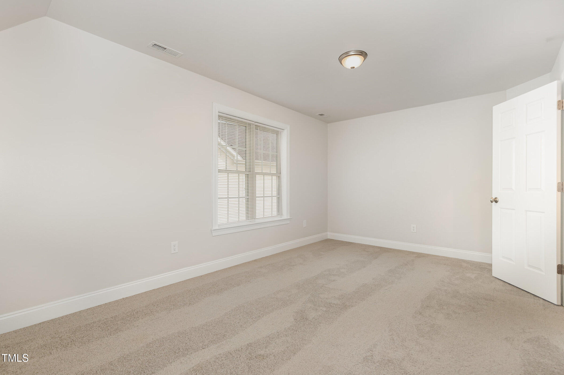 7936 Milltrace Run Raleigh, NC 27615 - Photo 14 of 21 an empty room with windows