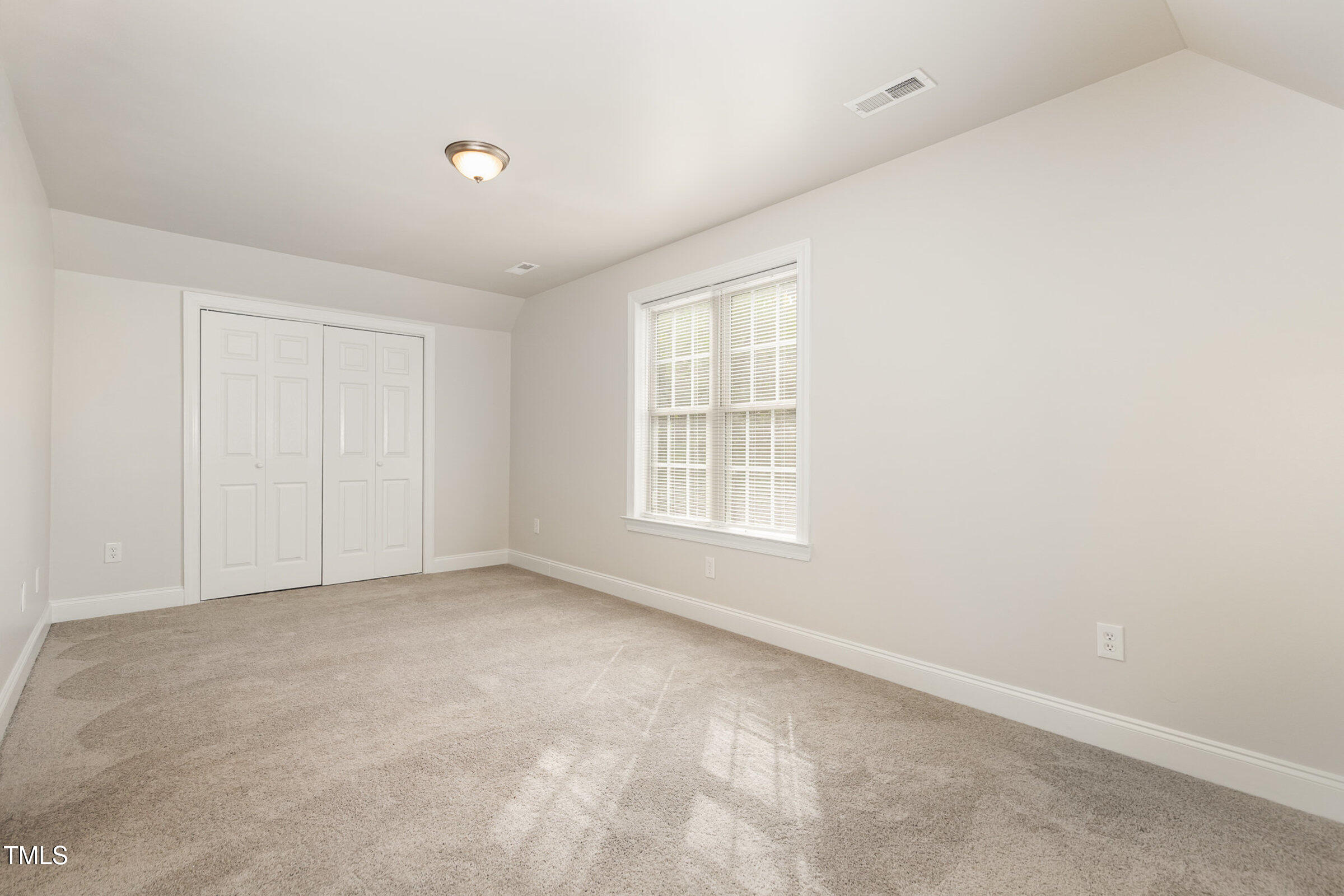 7936 Milltrace Run Raleigh, NC 27615 - Photo 15 of 21 an empty room with windows
