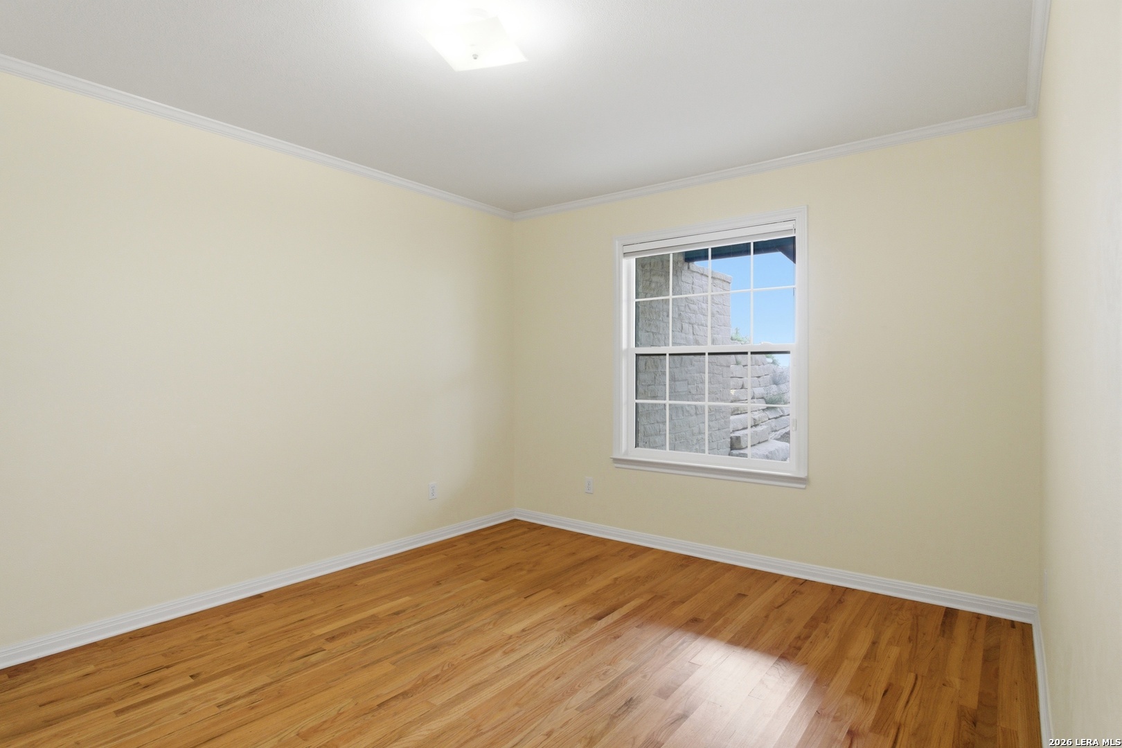 26 Seewald Road Boerne, TX 78006 - Photo 32 of 33 an empty room with wooden floor and windows