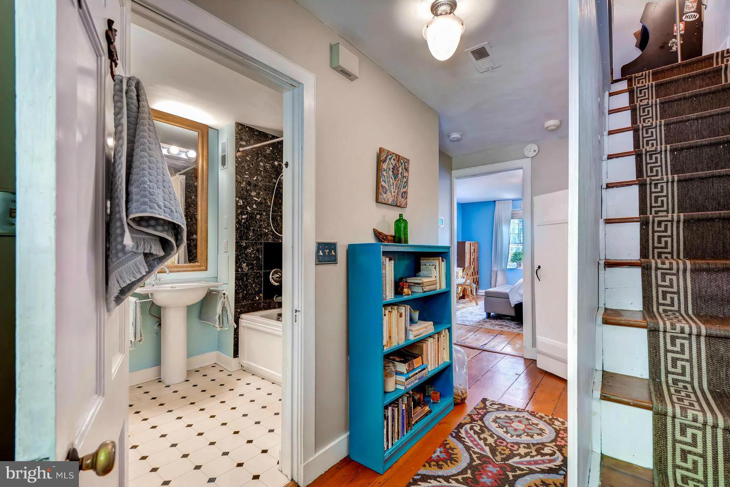 5106 North Franklintown Road Baltimore, MD 21207 - Photo 12 of 22 a bedroom with furniture and a book shelf