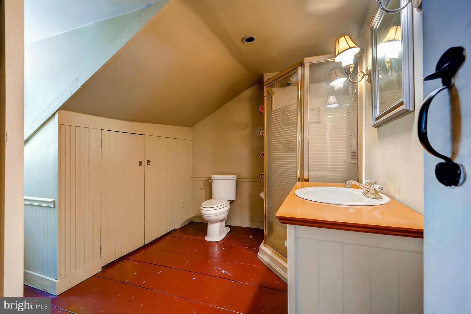 5106 North Franklintown Road Baltimore, MD 21207 - Photo 14 of 22 a bathroom with a sink a toilet and shower