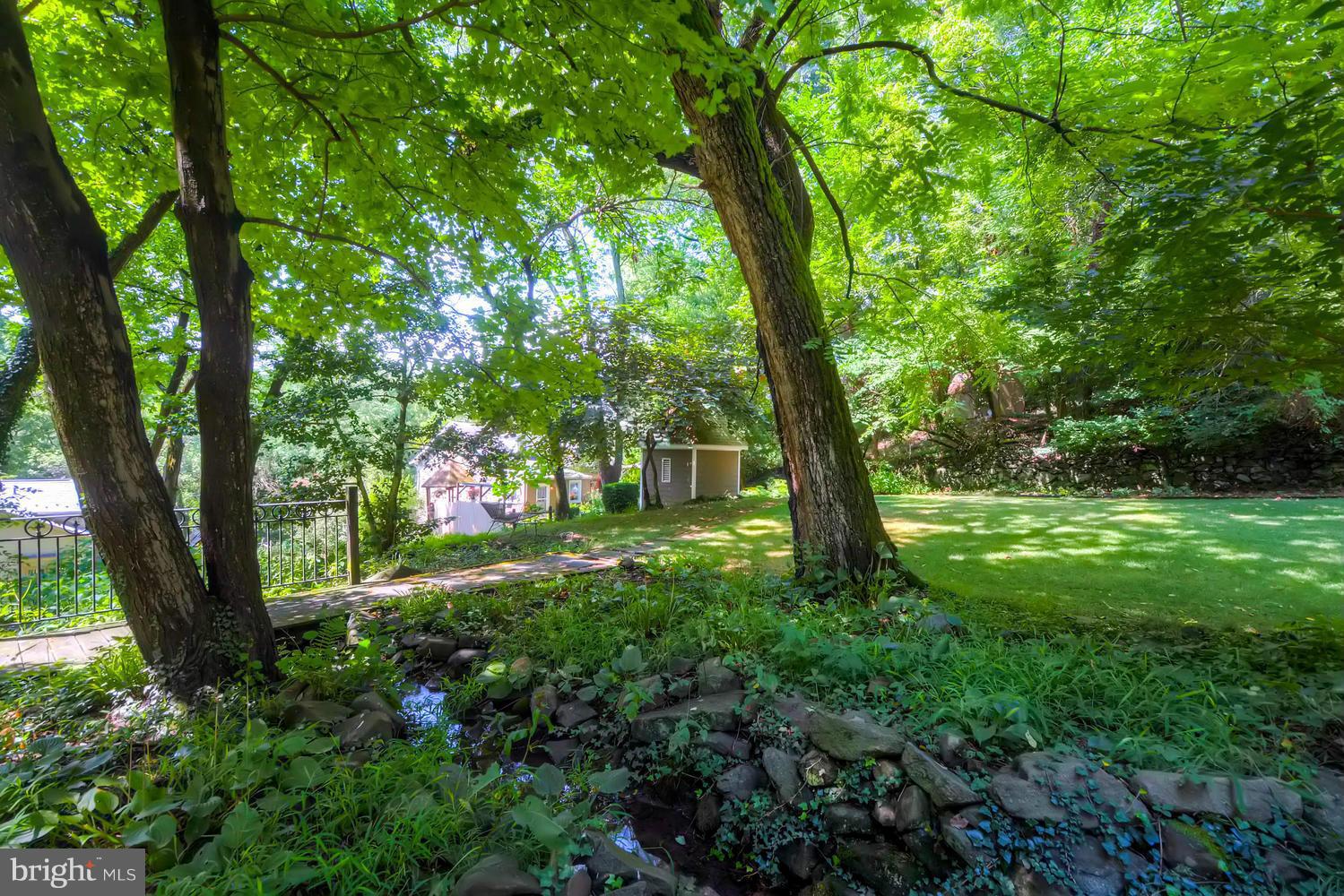 5106 North Franklintown Road Baltimore, MD 21207 - Photo 17 of 22 a big yard with lots of green space and trees