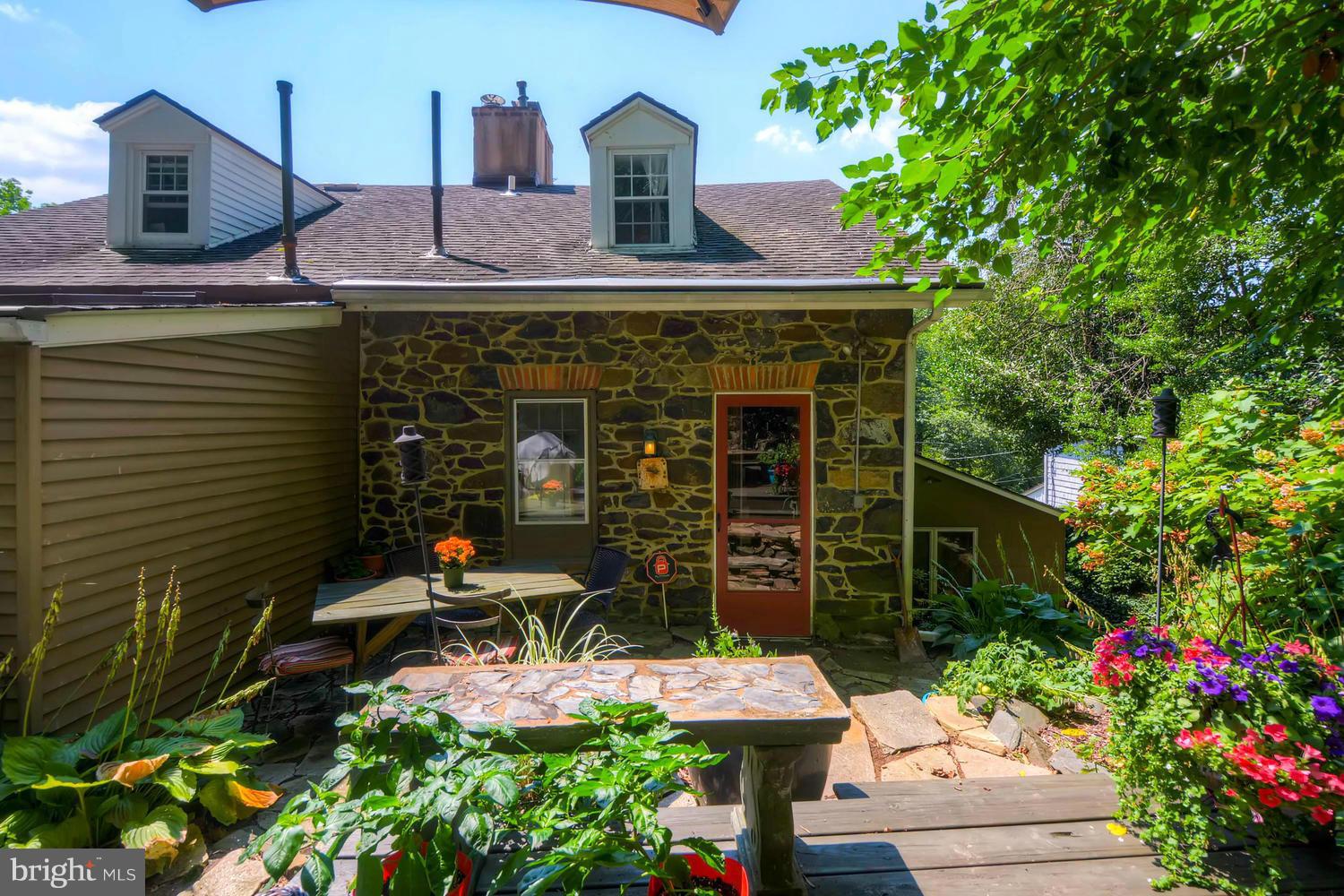 5106 North Franklintown Road Baltimore, MD 21207 - Photo 19 of 22 a front view of a house with a garden