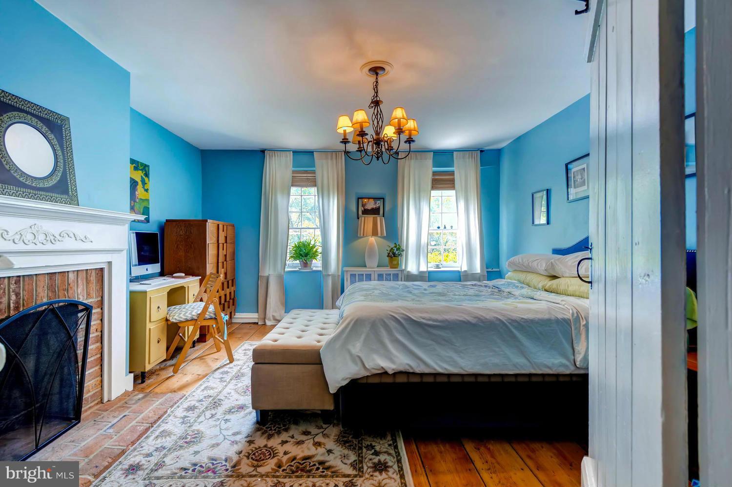 5106 North Franklintown Road Baltimore, MD 21207 - Photo 9 of 22 a bedroom with a bed and a fireplace