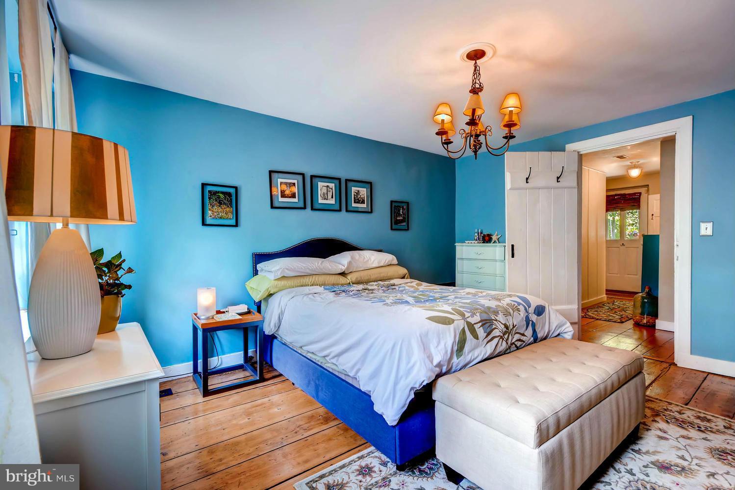 5106 North Franklintown Road Baltimore, MD 21207 - Photo 10 of 22 a bedroom with bed and a chandelier