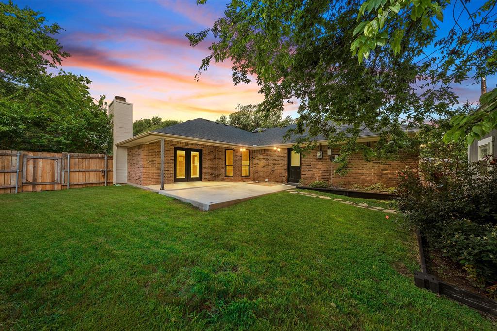310 Ruth Drive Hewitt, TX 76643 - Photo 18 of 25 Expansive backyard featuring a manicured lawn, a concrete patio, and mature trees