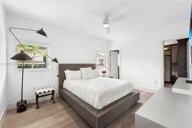 a bedroom with a bed and a table