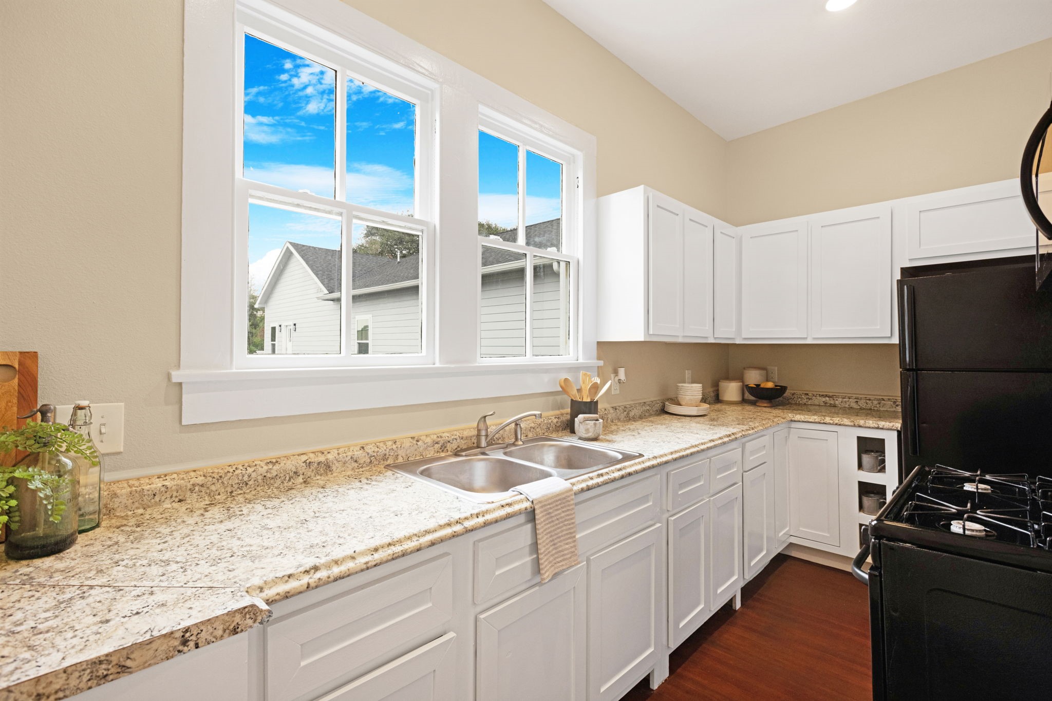 910 9th Street Galveston, TX 77550 - Photo 14 of 49 a kitchen with a sink stove and cabinets