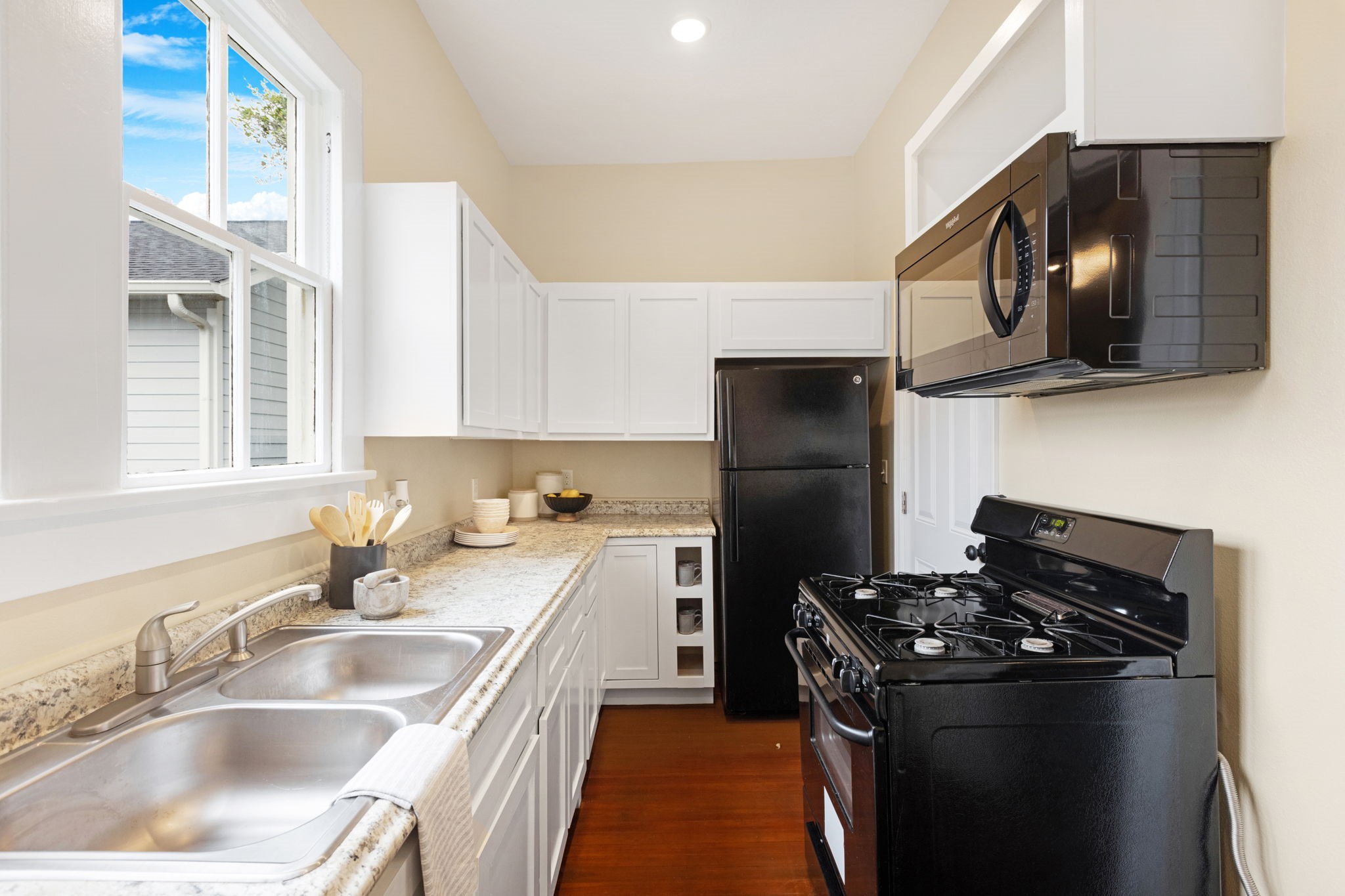 910 9th Street Galveston, TX 77550 - Photo 15 of 49 a kitchen with a sink stove and refrigerator