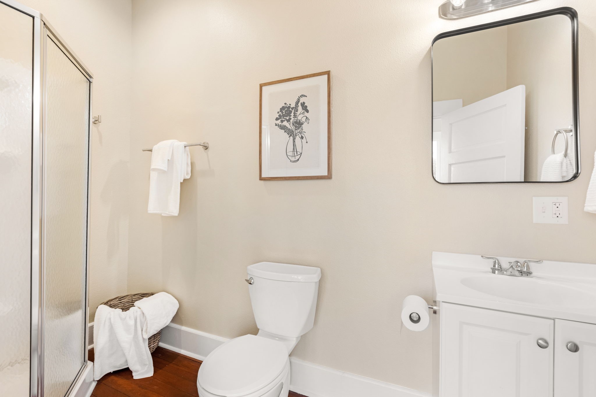 910 9th Street Galveston, TX 77550 - Photo 20 of 49 a bathroom with a toilet sink and mirror