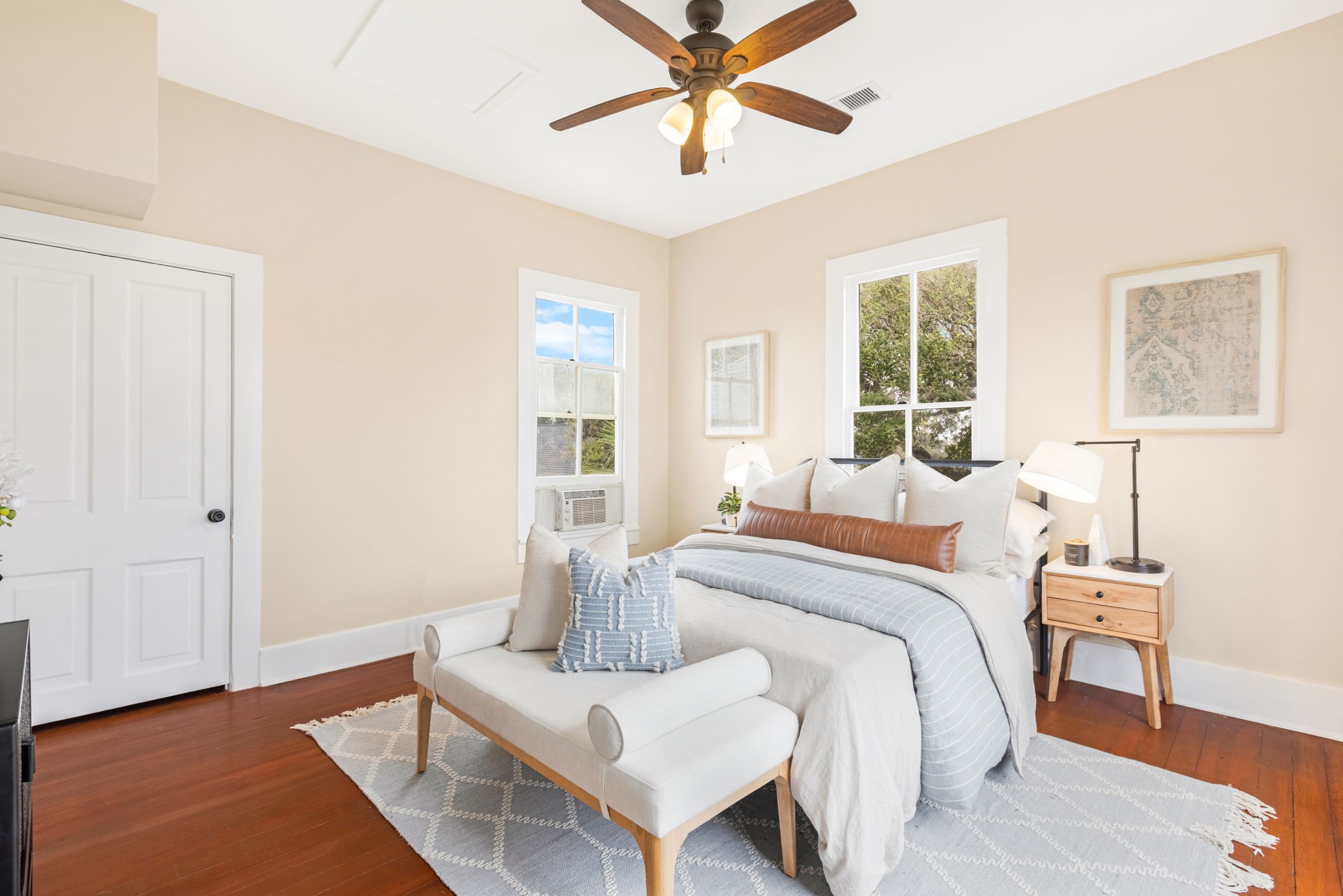 910 9th Street Galveston, TX 77550 - Photo 21 of 49 a bedroom with a bed and wooden floor