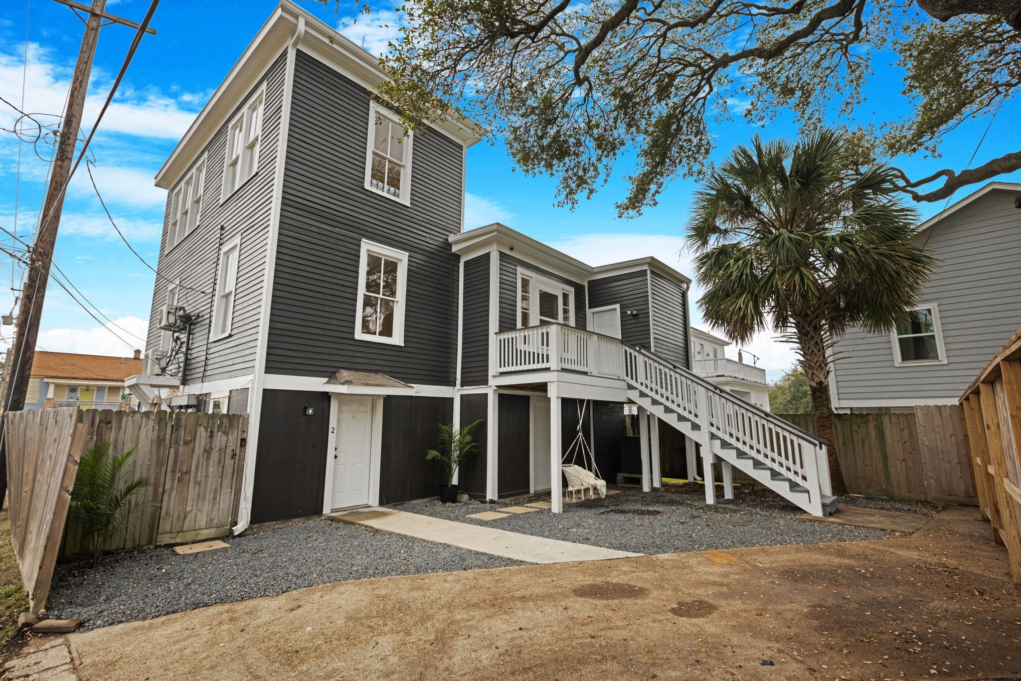 910 9th Street Galveston, TX 77550 - Photo 42 of 49 a front view of a house with a yard