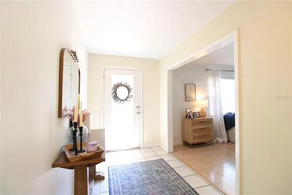 a view of a livingroom with a dinning table and workspace