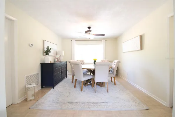 a view of a dining room with furniture and window