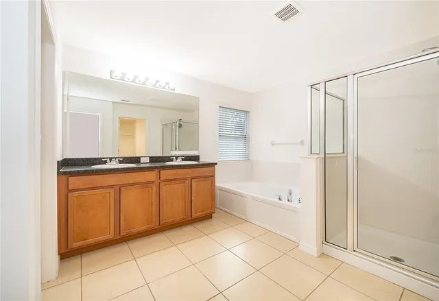 a bathroom with a bathtub and a sink