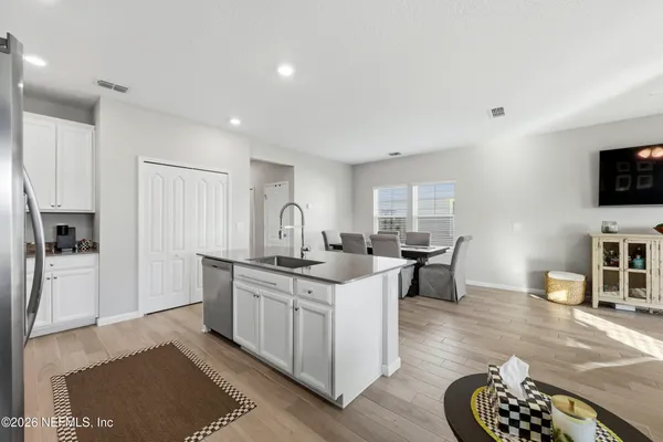 a kitchen with stainless steel appliances granite countertop a stove and a refrigerator
