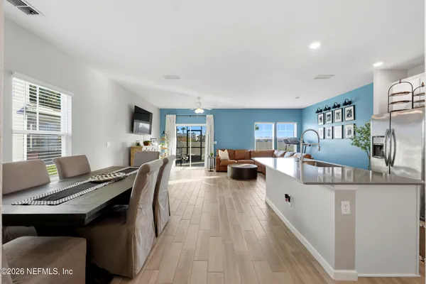 a living room with furniture a table and a window