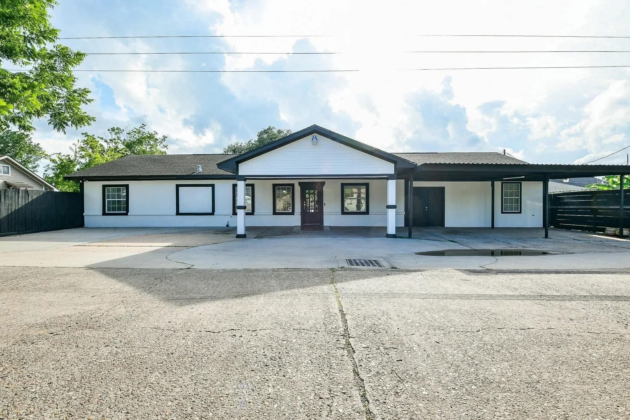 a front view of a house with yard