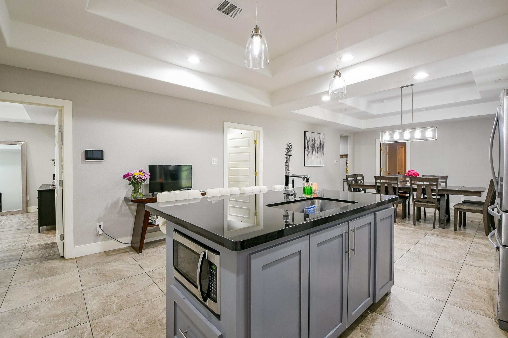 910 11th Street South Houston, TX 77587 - Photo 12 of 32 a kitchen with stainless steel appliances granite countertop a sink and a refrigerator