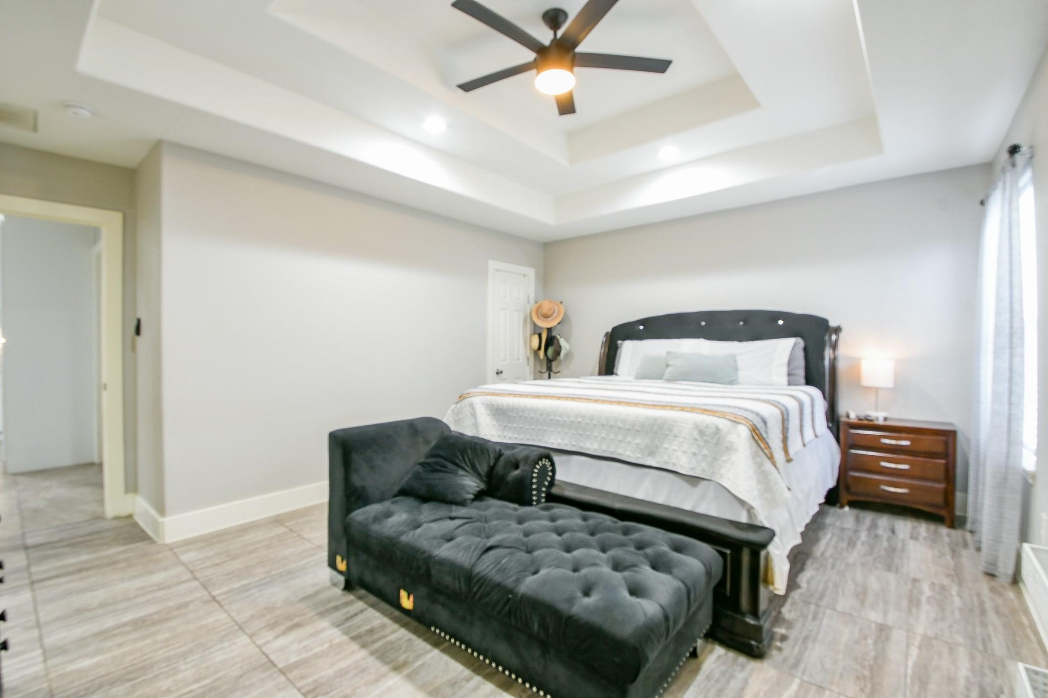 910 11th Street South Houston, TX 77587 - Photo 16 of 32 a bedroom with a bed and wooden floor