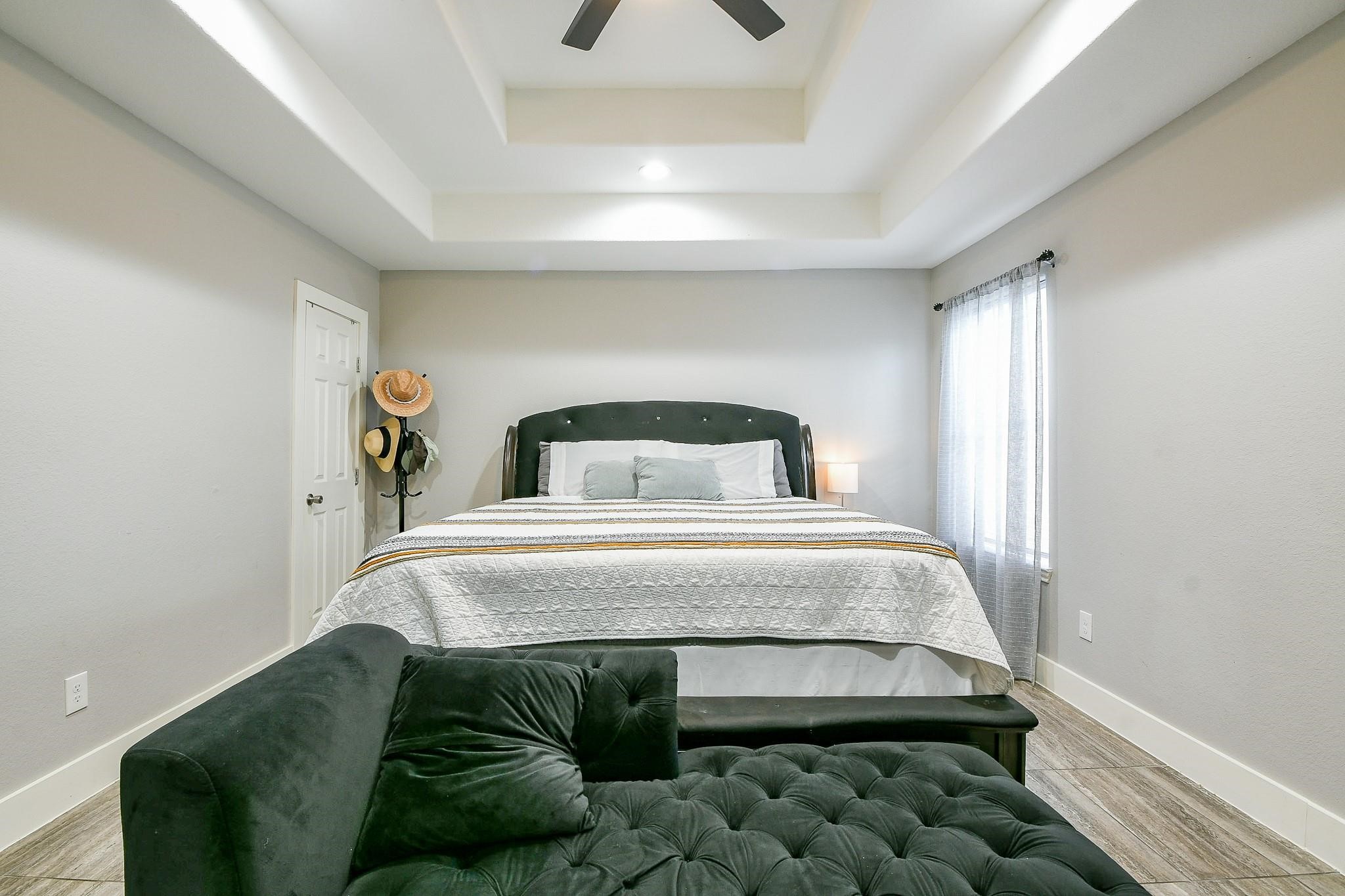 910 11th Street South Houston, TX 77587 - Photo 17 of 32 a bedroom with a bed and a window