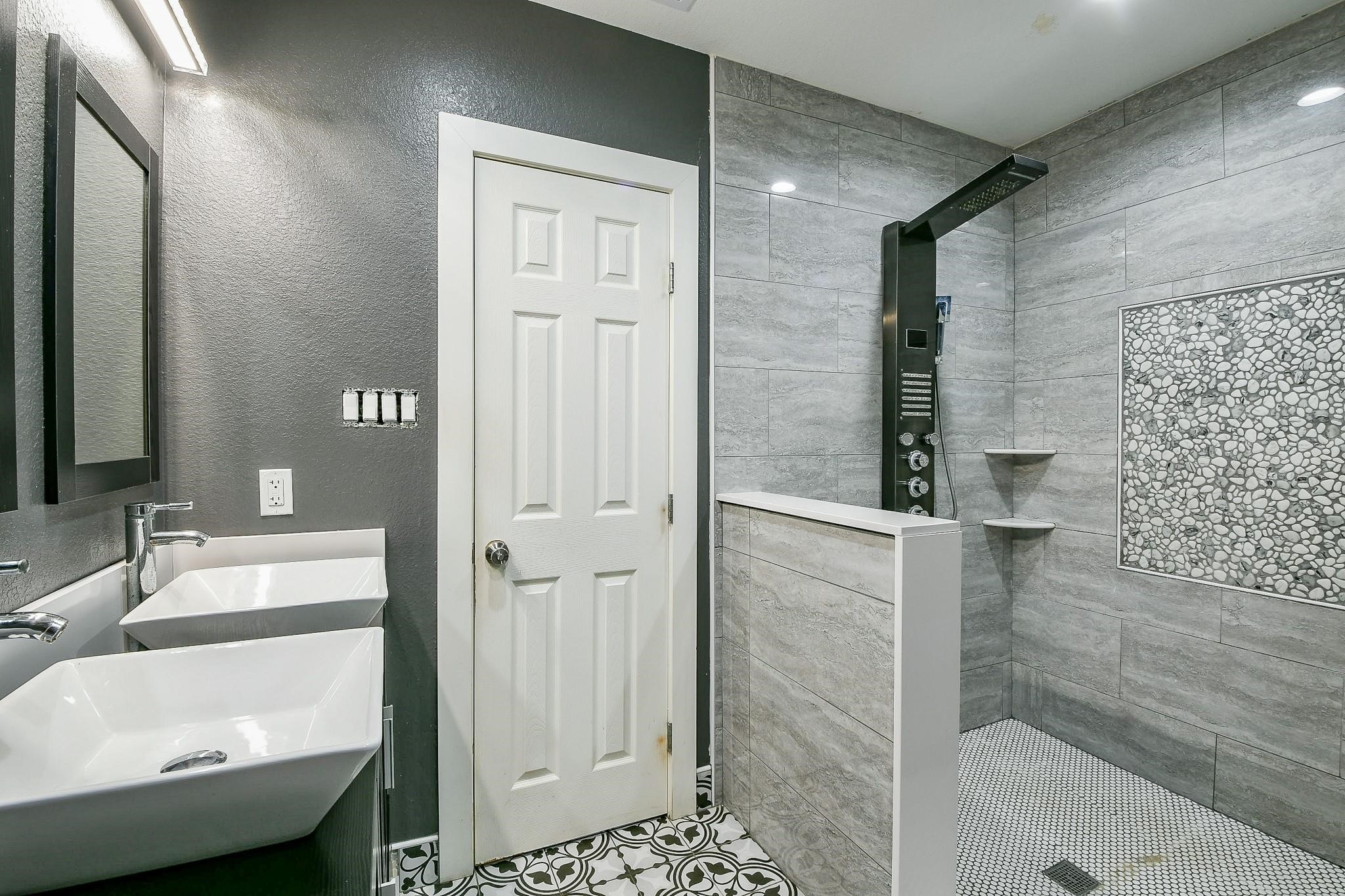 910 11th Street South Houston, TX 77587 - Photo 19 of 32 a bathroom with a sink and a mirror