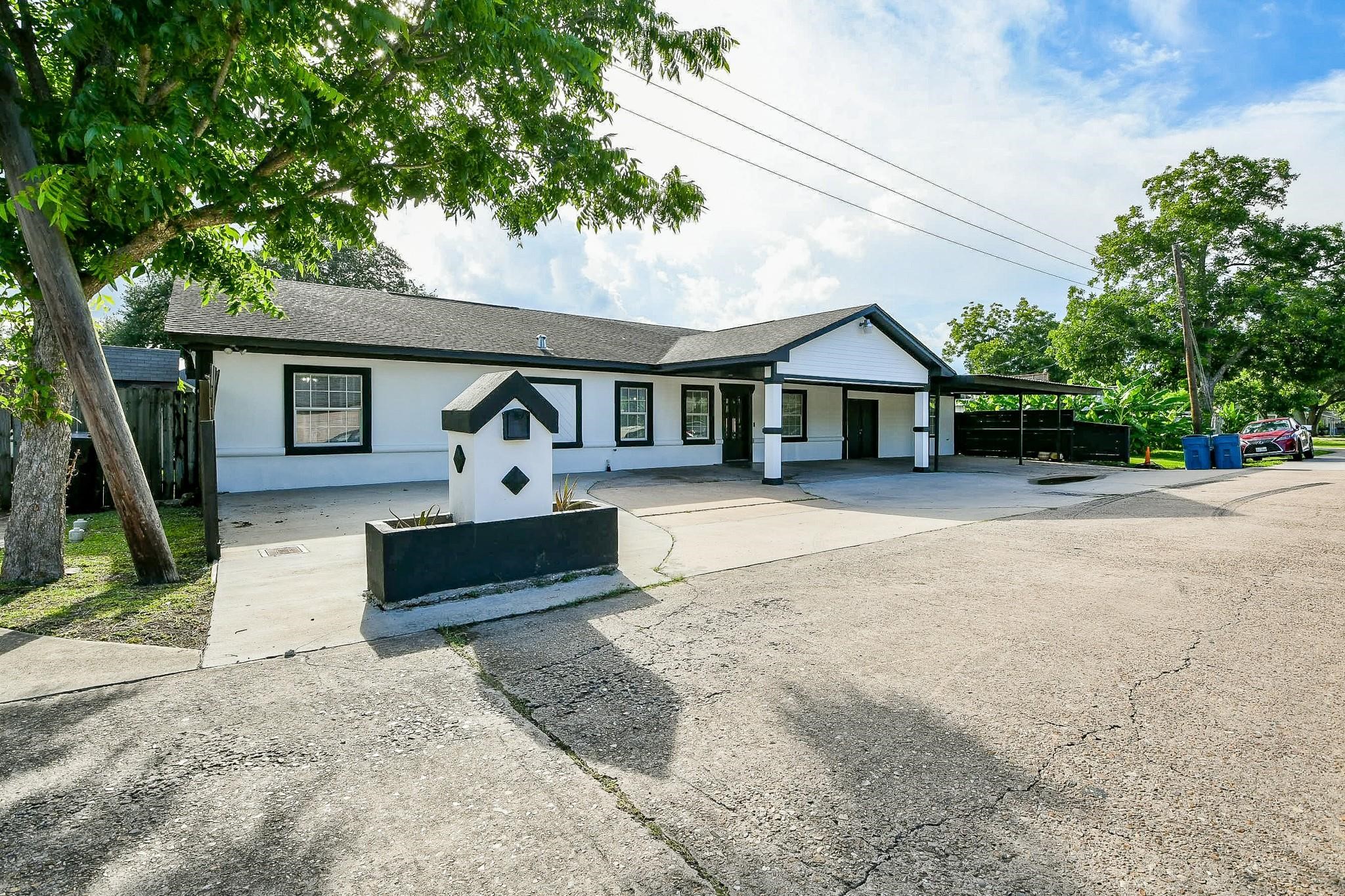 910 11th Street South Houston, TX 77587 - Photo 2 of 32 a front view of a house with a yard and potted plants