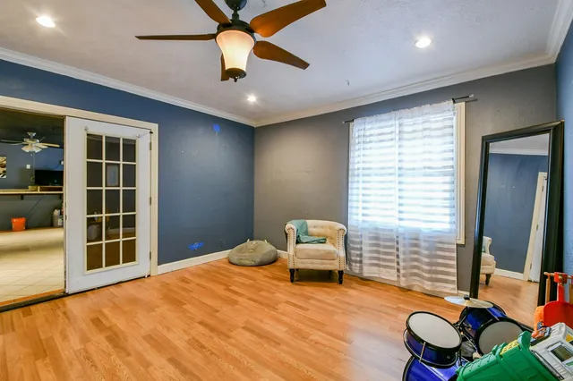 a bedroom with furniture window and wooden floor