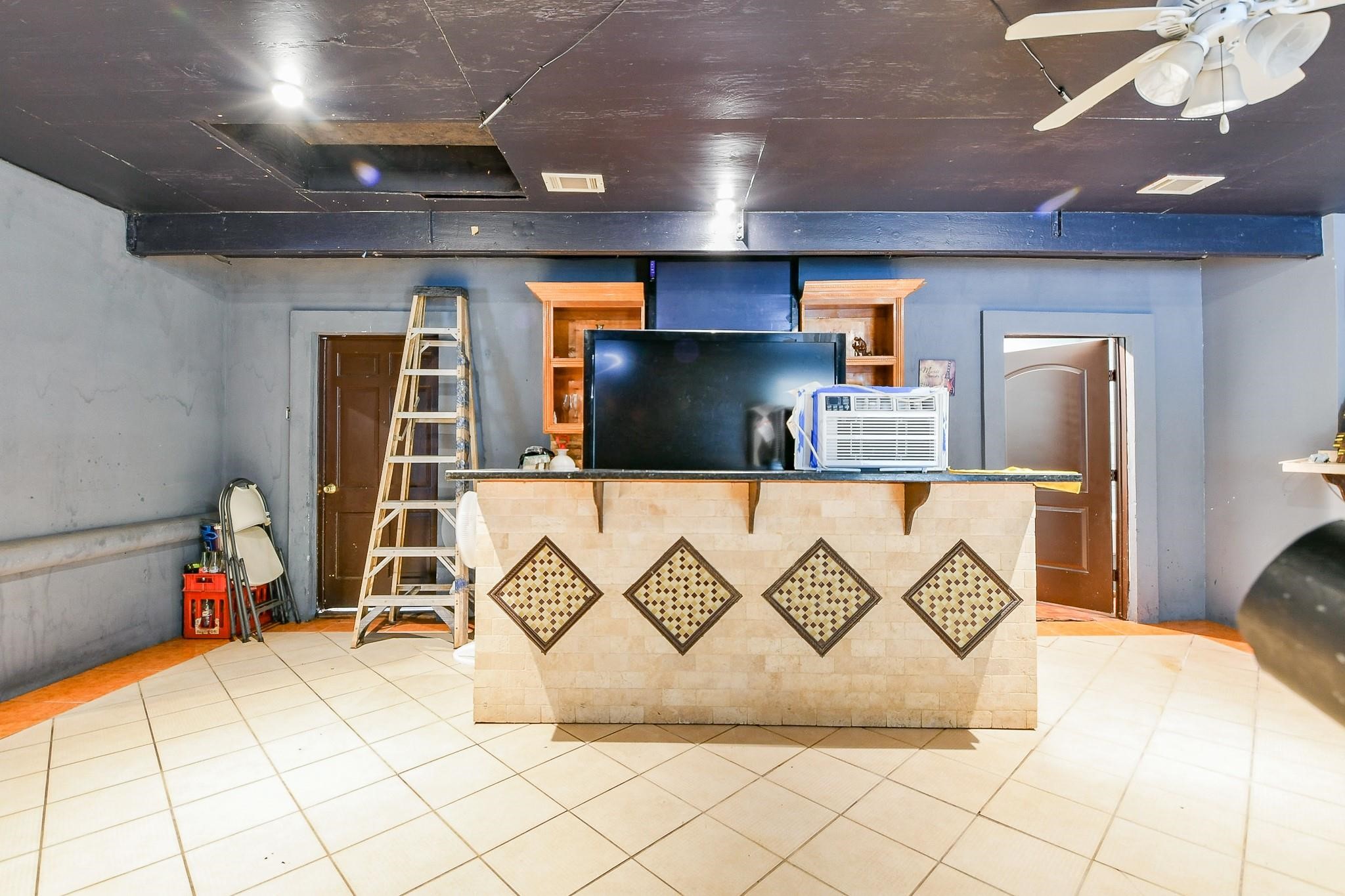 910 11th Street South Houston, TX 77587 - Photo 31 of 32 a living room with a couch and a table