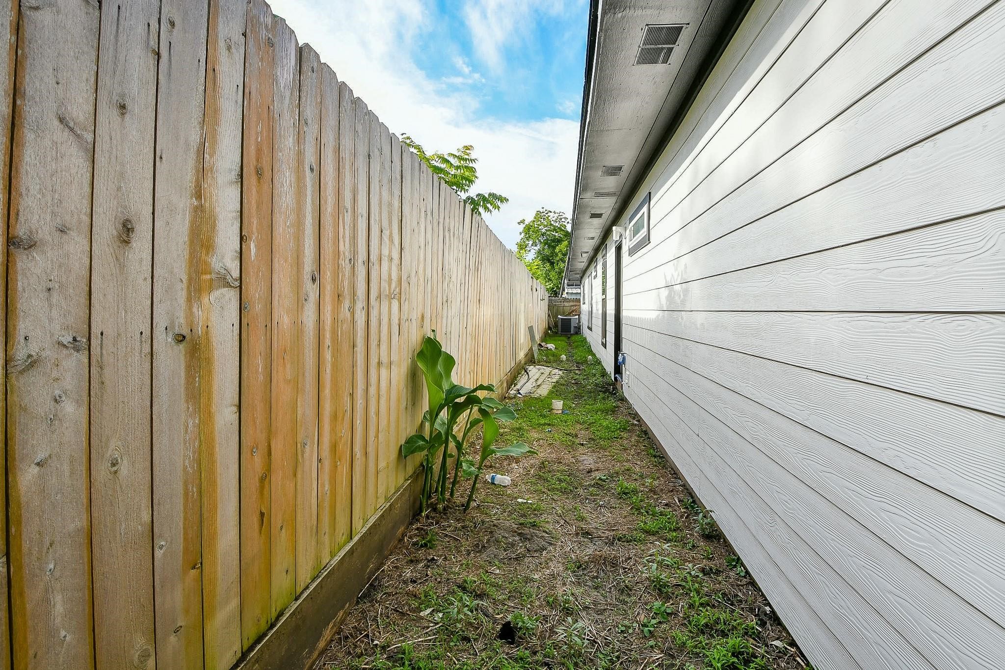 910 11th Street South Houston, TX 77587 - Photo 32 of 32 a backyard with potted plants