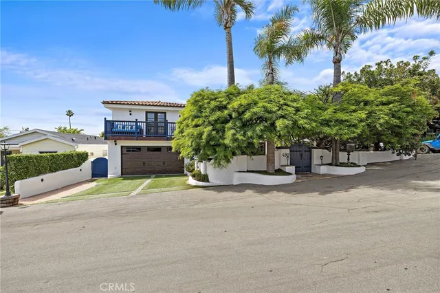 a building outdoor space with patio furniture and potted plants
