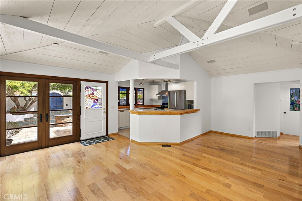 490 Agate Street Laguna Beach, CA 92651 - Photo 15 of 38 a living room with stainless steel appliances kitchen island granite countertop a refrigerator stove and sink