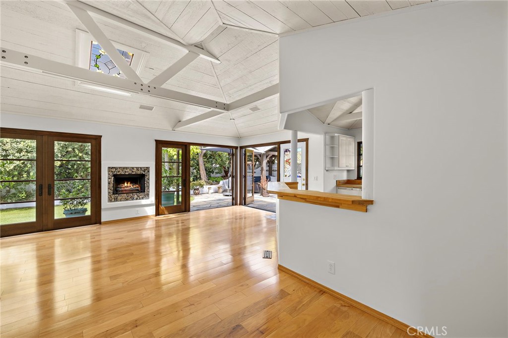 490 Agate Street Laguna Beach, CA 92651 - Photo 17 of 38 a swimming pool with large glass windows and painted walls